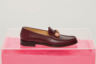 Bordeaux Calf Leather Melchora Stone Loafer on Pink Acrylic Display - Styled Shot | Gabriela Hearst