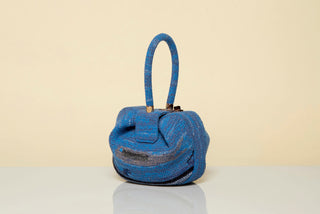Water Multi Crochet Cashmere Nina Bag - Side Profile on Surface with Rose Gold Closure | Gabriela Hearst