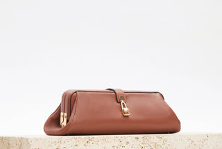 Cognac Nappa Leather Paola Clutch - Lifestyle Shot | Gabriela Hearst