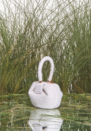 Ivory Cashmere Boucle Demi Bag - Natural Grass Lifestyle Setting | Gabriela Hearst