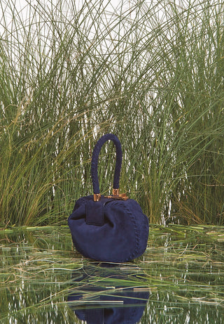 Navy Suede Demi Bag in Natural Grass Setting | Gabriela Hearst