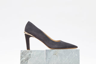 Charcoal Suede Edwina Stiletto Pumps on Marble Block - Styled Product Shot | Gabriela Hearst