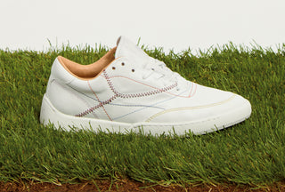 White Leather Ohio Slip-on Sneaker on Grass - Lifestyle Shot | Gabriela Hearst