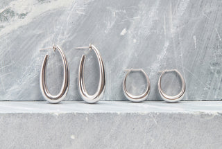 White Gold Drop Earrings in Large and Small Sizes on Stone Surface - Size Comparison | Gabriela Hearst