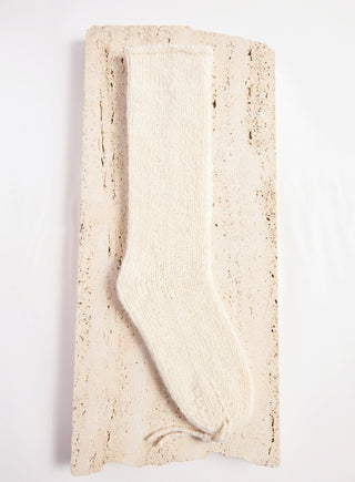 Ivory Cashmere Nikola Knit Socks - Single Sock on Travertine Stone Detail | Gabriela Hearst