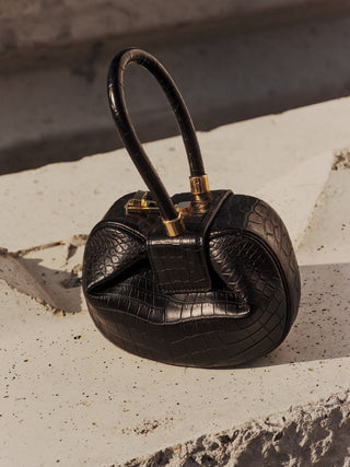 Black Crocodile Demi Bag - Top-Down Lifestyle View, Luxury Evening Handbag | Gabriela Hearst