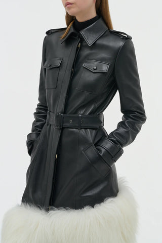 Black Leather Isak Trench with Ivory Shearling - Front Detail Close-up Showing Belt and Pockets | Gabriela Hearst