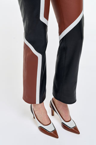 Navarre Leather Moto Pant - Leg & Hem Detail, Cognac & Black Color-Block Paneling On Model | Gabriela Hearst