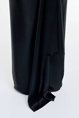Black Silk Satin Jessamy Maxi Dress - Close-Up Extended Hem Sweep and Fluid Drape Detail | Gabriela Hearst