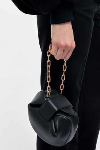 Black Nappa Leather Soft Demi Clutch with Chain Held by Model - On Model Styling | Gabriela Hearst