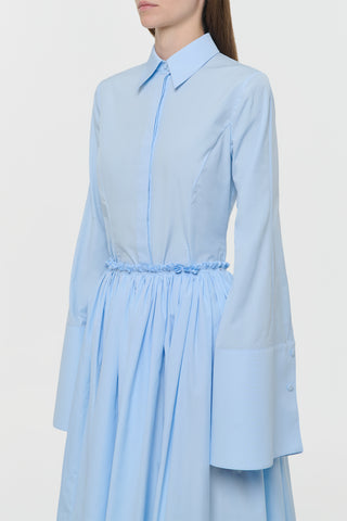 Light Blue Sea Island Cotton Jataya Shirt Styled Look - Side Profile On Model | Gabriela Hearst