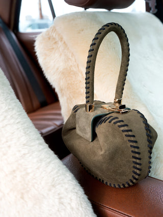Olive Suede Whipstitch Demi Bag - Lifestyle Setting | Gabriela Hearst