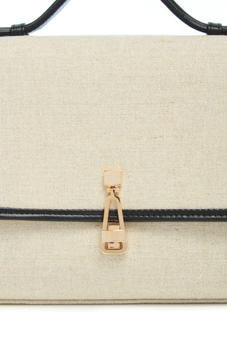 Medium Leonora Linen Flap Bag Rose Gold Turn-Lock Closure on Beige Linen - Hardware Close-Up | Gabriela Hearst