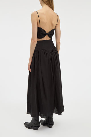 Black Aloe Linen Juniper Skirt - On Model Back View with Bow-Detail Top | Gabriela Hearst