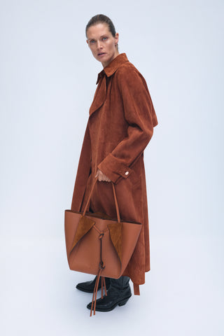 Cognac Suede Long Coat with Leather Handbag - Side Profile | Gabriela Hearst