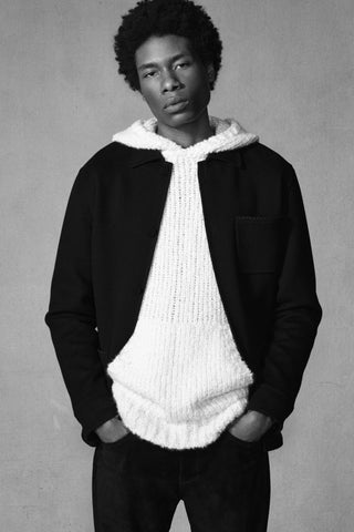 Ivory Cashmere Aditi Hoodie Layered Under Black Jacket - Portrait View | Gabriela Hearst