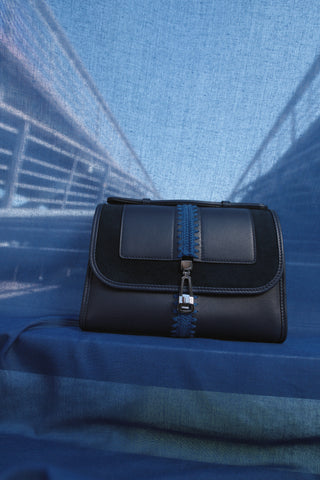 Navy Leonora Flap Bag Lifestyle Shot on Blue Fabric - Styled Photography | Gabriela Hearst