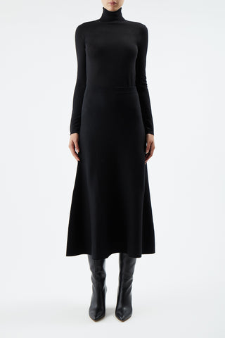 Black Knit Midi Skirt Styled with Turtleneck - Front View On Model | Gabriela Hearst