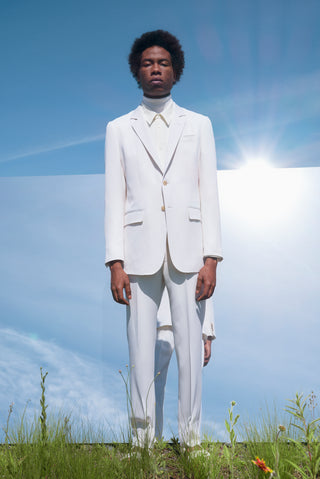 White Tailored Suit On Model Against Sky - Resort 2023 Look 31 | Gabriela Hearst