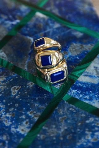 Blue Lapis 18K Gold Rings - Styled on Marble Surface | Gabriela Hearst